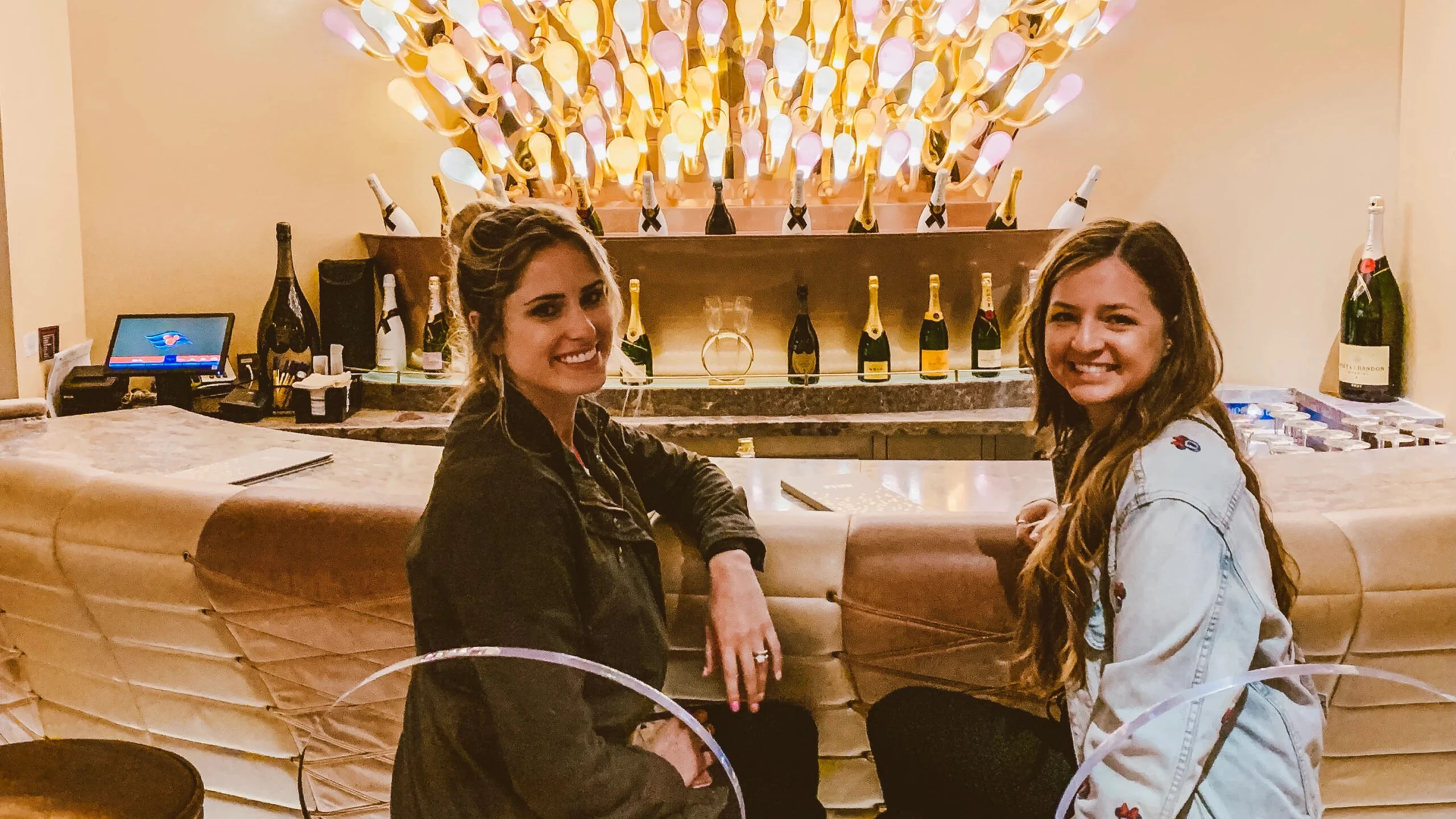 Two women smiling at the bar in PINK on the Disney Dream