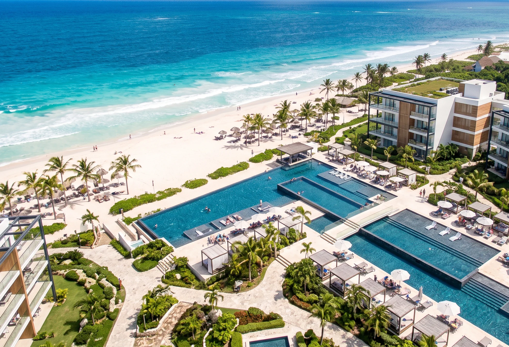 Dominican Aerial view of a beachfront resort with pools and palm trees in the Dominican Republic